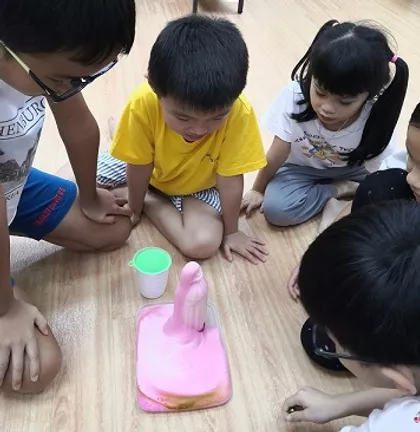 Children exploring a hands-on STEM experiment at Oasis